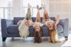 Three Girl Laying Upside Down on a Couch