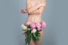 Woman Covering Her Bare Chest with Flowers Wrapped around her Privates