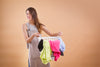 Woman Making a Stink Face Holding a Basket of Dirty Clothes