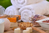 Different Types of Soap and White Towels on a Table