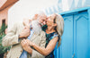 Older Woman Kissing the Forehead of an Older Man