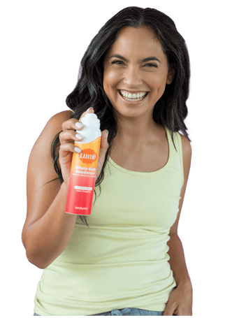 Woman holding Lume Spray Deodorant product