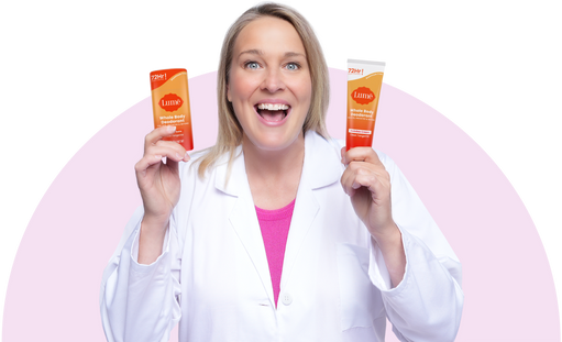 Dr. Shannon Klingman smiling in white lab coat with Lume products in hands