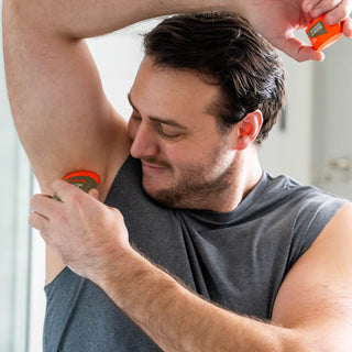 Man applying Mando smooth solid under his armpit