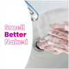 Person washing their hands in the sink with a Lume soap bar and the text: Smell better naked