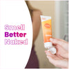 Hand holding an orange and white Lume toasted coconut cream deodorant tube and the text: smell better naked