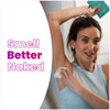 Woman applying a Lume cool cucumber deodorant wipe and text: Smell better naked